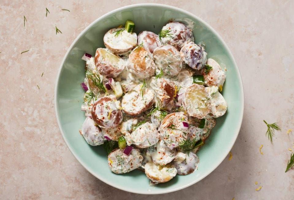 <p>For fans of <a href="https://www.delish.com/cooking/recipe-ideas/recipes/a53128/classic-potato-salad-recipe/" rel="nofollow noopener" target="_blank" data-ylk="slk:potato salad" class="link ">potato salad</a>, there is endless possibility for different kinds of flavorings and mix-ins. You like red potatoes? We got <a href="https://www.delish.com/cooking/recipe-ideas/a36743797/red-potato-salad-recipe/" rel="nofollow noopener" target="_blank" data-ylk="slk:red potato salad" class="link ">red potato salad</a>. We also have <a href="https://www.delish.com/cooking/recipe-ideas/a21796127/antipasto-potato-salad-recipe/" rel="nofollow noopener" target="_blank" data-ylk="slk:antipasto potato salad" class="link ">antipasto potato salad</a>, <a href="https://www.delish.com/cooking/recipe-ideas/a27032493/ranch-potato-salad-recipe/" rel="nofollow noopener" target="_blank" data-ylk="slk:ranch potato salad" class="link ">ranch potato salad</a>, <a href="https://www.delish.com/cooking/recipe-ideas/a19637562/hot-german-potato-salad-recipe/" rel="nofollow noopener" target="_blank" data-ylk="slk:German potato salad" class="link ">German potato salad</a>. But what we didn’t have was <a href="https://www.delish.com/cooking/recipe-ideas/a30715622/authentic-tzatziki-recipe/" rel="nofollow noopener" target="_blank" data-ylk="slk:tzatziki" class="link ">tzatziki</a> potato salad, which is perfect for summer. This salad is very dill forward, nicely lemony, and bright with yogurt, crunchy cucumber—both fresh and pickled—and creamy boiled baby reds. <br><br>Get the <strong><a href="https://www.delish.com/cooking/recipe-ideas/a39630682/tzatziki-potato-salad-recipe/" rel="nofollow noopener" target="_blank" data-ylk="slk:Tzatziki Potato Salad recipe" class="link ">Tzatziki Potato Salad recipe</a></strong>.</p>