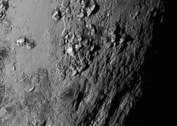 NASA's New Horizons spacecraft captured this image of Pluto's surface, which reveals ice mountains about 11,000 feet (3,500 meters) high, on July 14, 2015.