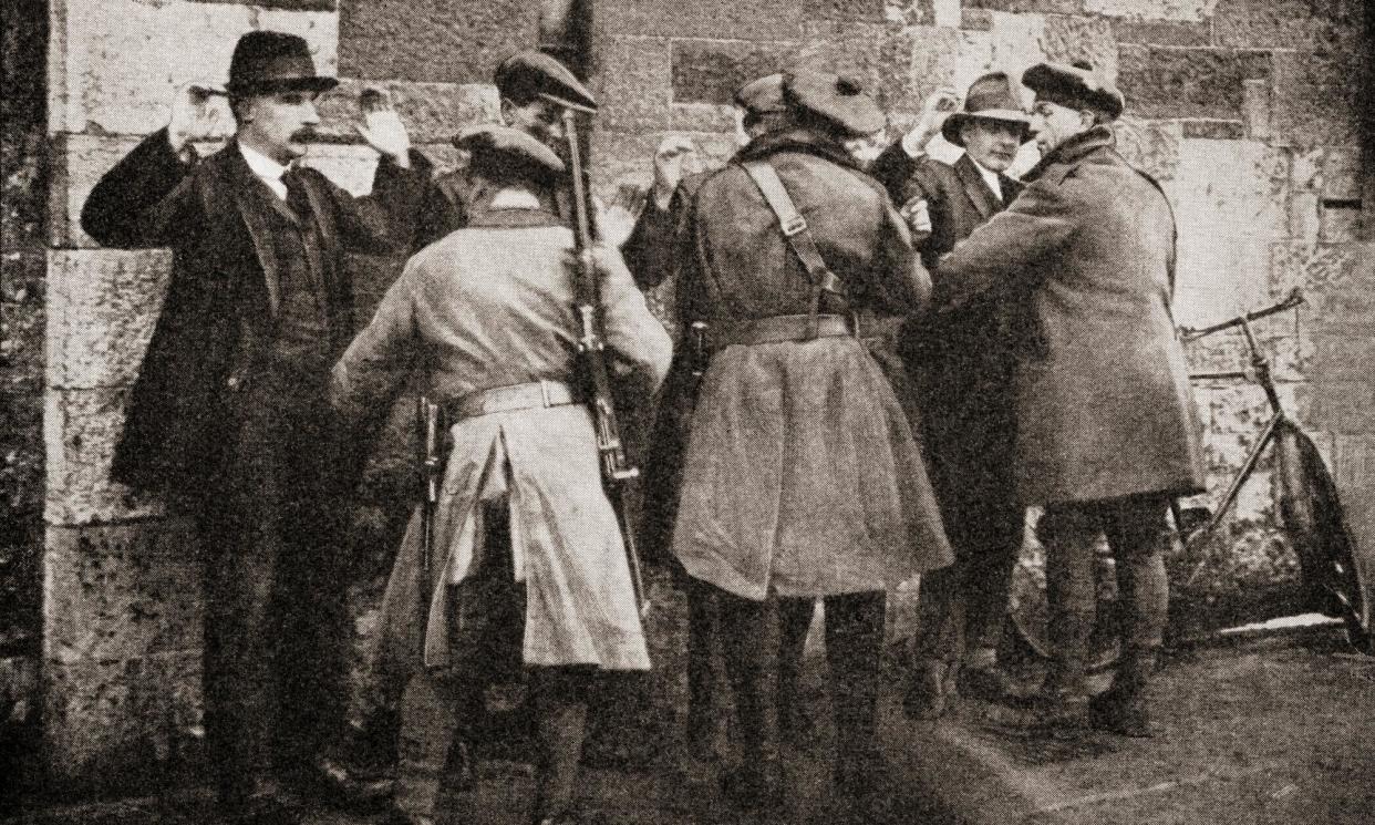 <span>Suspects searched in Dublin in 1920 during the Irish war of independence. The Irish and British authorities have drawn a veil over the worst period for abductions and killings.</span><span>Photograph: Universal History Archive/Universal Images Group/Getty Images</span>