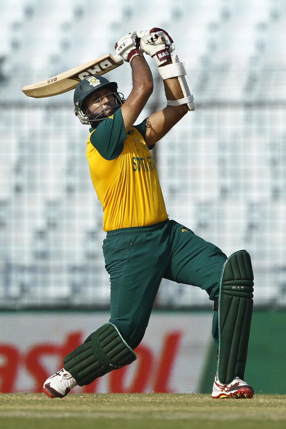 South Africa's Hashim Amla plays a shot during their ICC Twenty20 Cricket World Cup match against New Zealand, in Chittagong, Bangladesh, Monday, March 24, 2014. (AP Photo/A.M. Ahad)