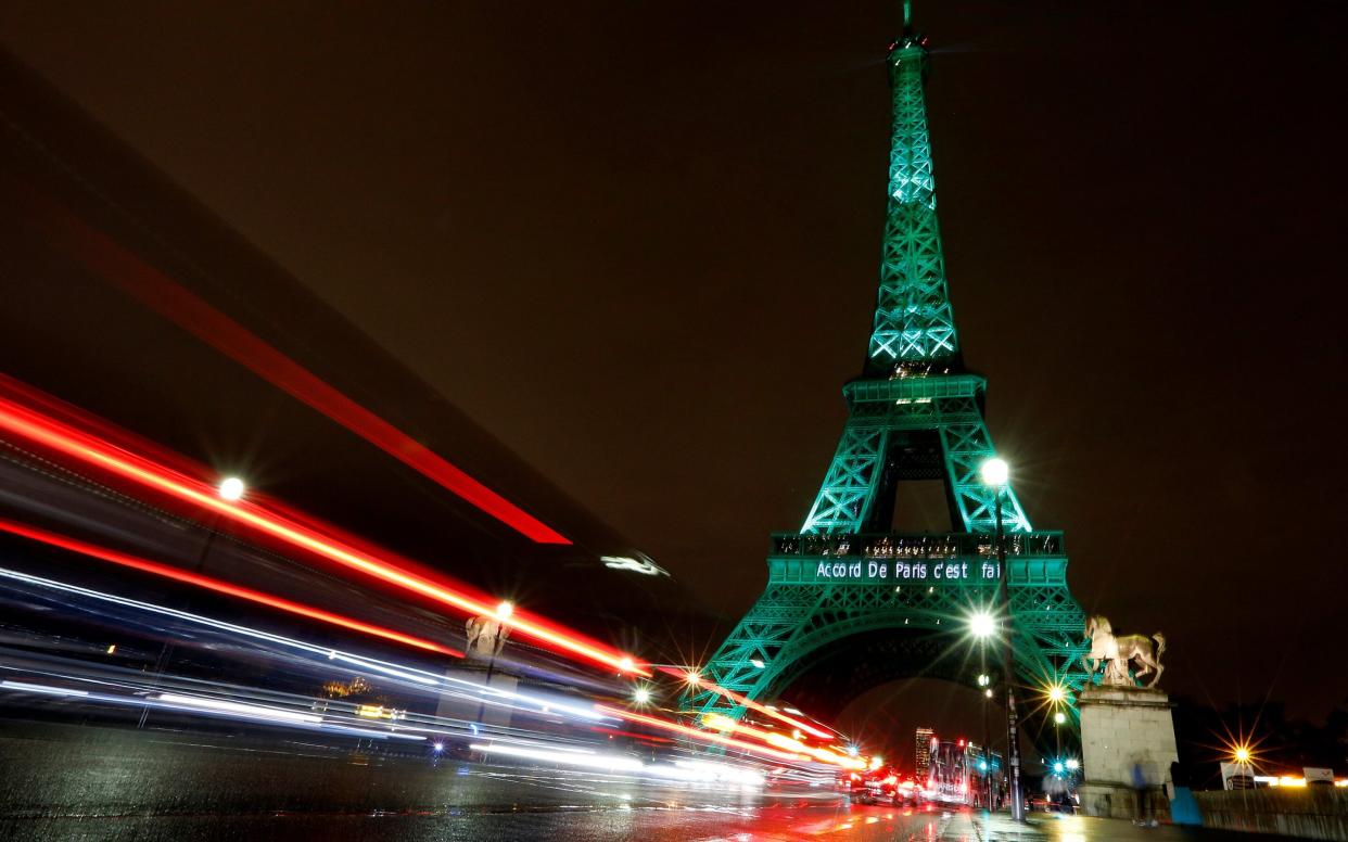 The Eiffel Tower was illuminated green when the historic Paris Agreement was sealed in November 2015.   - Reuters
