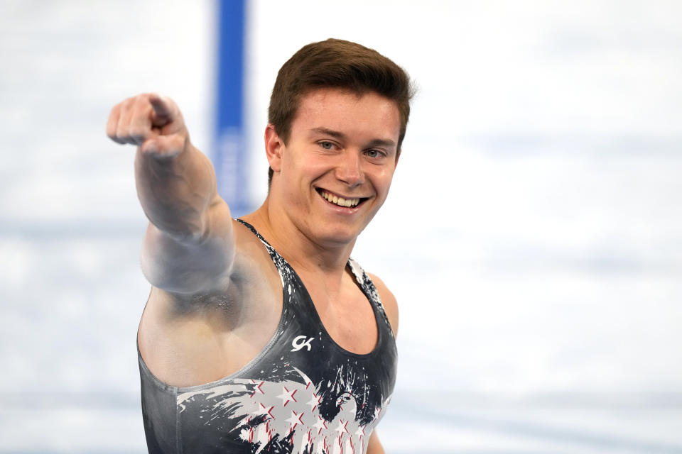 Brody Malone, of the United States, finishes on the parallel bars during the artistic gymnastics men's all-around final at the 2020 Summer Olympics, Wednesday, July 28, 2021, in Tokyo. (AP Photo/Gregory Bull)