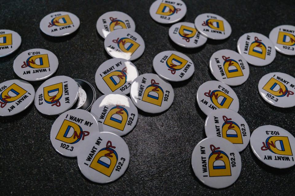 "I want my DNP" buttons -- representing Dover radio station WDNP-FM (102.3) -- are shown on a studio reception desk at the station.