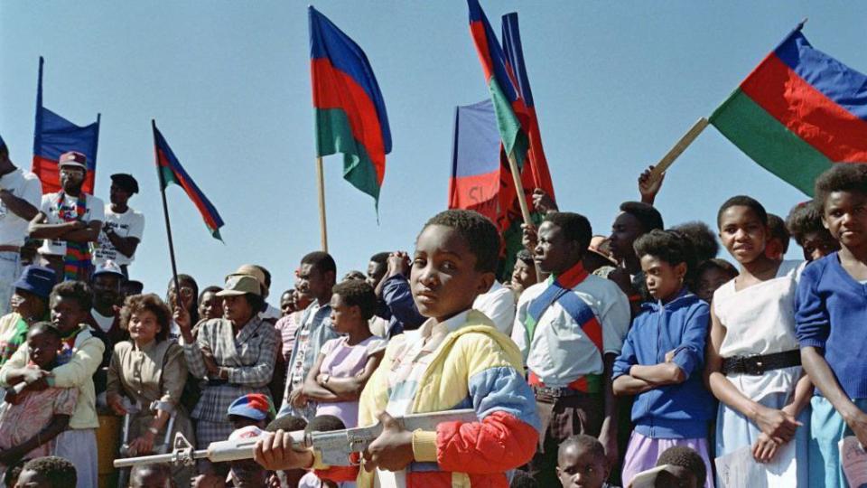 Thousands of supporters of the South West African People's Organization (SWAPO) sing songs of freedom, at a rally to celebrate Swapo's 22nd anniversary of its guerrilla war against South Africa's continued occupation of Namibia, on 28 August 1988, in Windhoek.