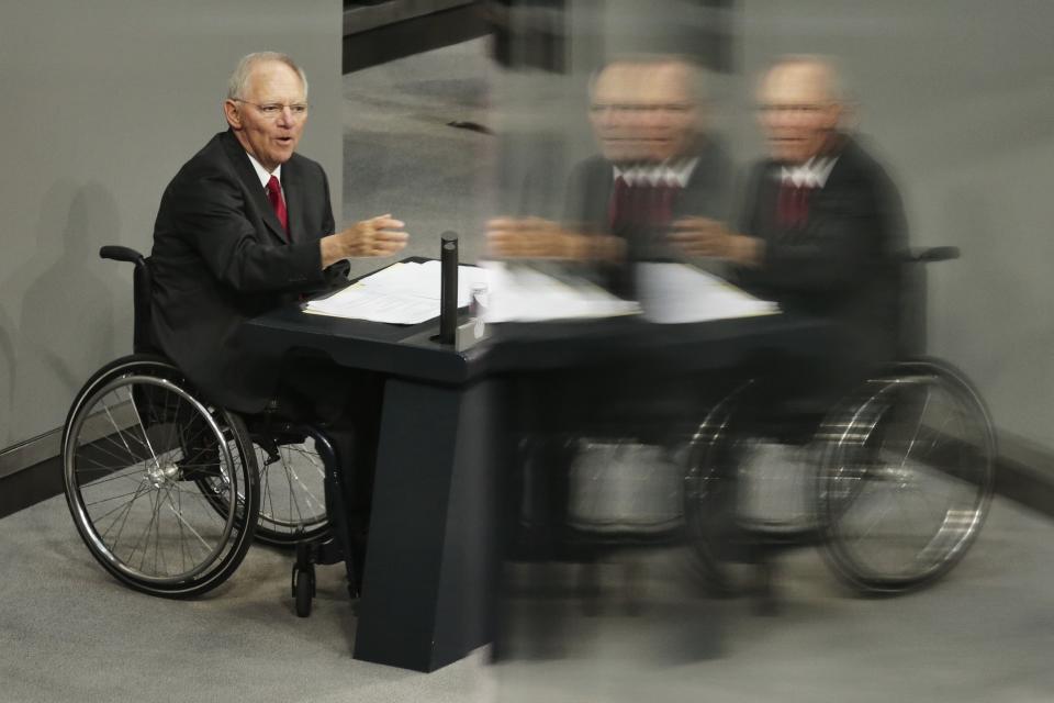 FILE - German Finance Minister Wolfgang Schaeuble delivers his speech during the first day of the debate about the German budget for 2014 at the parliament Bundestag in Berlin, Tuesday, April 8, 2014. Wolfgang Schaeuble, who helped negotiate German reunification in 1990 and as finance minister was a central figure in the austerity-heavy effort to drag Europe out of its debt crisis more than two decades later, has died on Tuesday, Dec. 26, 2023. He was 81. (AP Photo/Markus Schreiber, File)