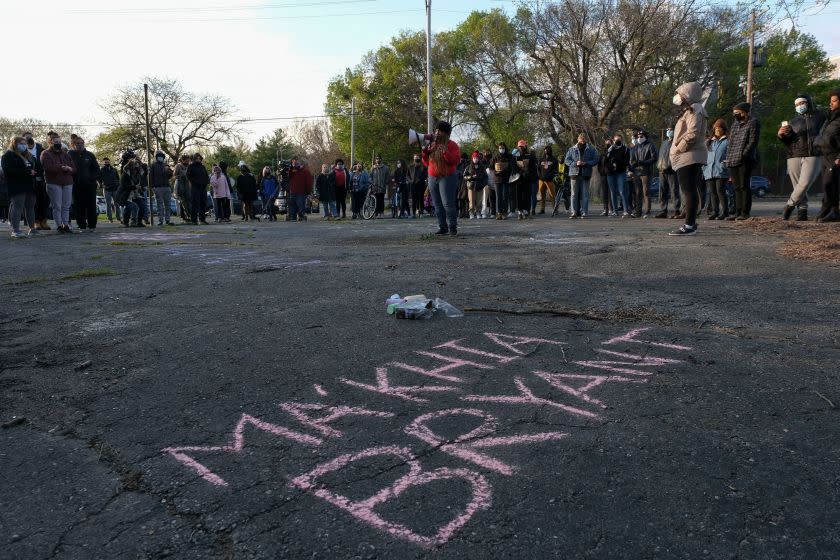 A woman speaks on a megaphone as people gather for a vigil in Columbus, Ohio on April 21, 2021 to remember MaKhia Bryant, 16, who was shot and killed by a Columbus Police Department officer. - Police in the US state of Ohio fatally shot a Black teenager who appeared to be lunging at another person with a knife, less than an hour before former officer Derek Chauvin was convicted of murdering George Floyd. The shooting occurred at a tense time with growing outrage against racial injustice and police brutality in the United States, and set off protests in the city of Columbus. (Photo by Jeff Dean / AFP) (Photo by JEFF DEAN/AFP via Getty Images)