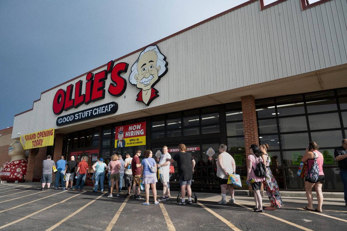 Customers waited in line to be let in the store Wednesday at the grand opening of the new Ollie’s in Overland Park.