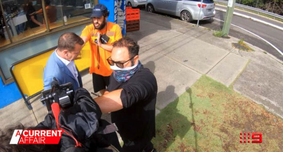 One of Dr Daniel Aronov's supporters was caught on camera attacking A Current Affair reporter Steve Marshall. Source: A Current Affair
