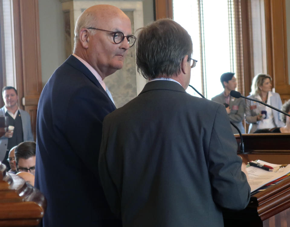 Kansas state Rep. Jim Ward, left, D-Wichita, debates House Insurance Committee Chairman Jene Vickrey, R-Louisburg, over an insurance bill, Friday, April 5, 2019, at the Statehouse in Topeka, Kan. The bill would allow the Kansas Farm Bureau to sell health coverage that does not comply with federal mandates; Ward opposes it, and Vickrey supports it. (AP Photo/John Hanna)