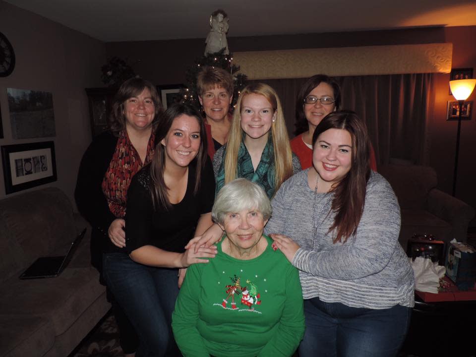 Stephanie Angel's mom, Eileen Wood (front), loved Christmas. Eileen, shown here with her three daughters and three granddaughters in 2015, died in July 2022.