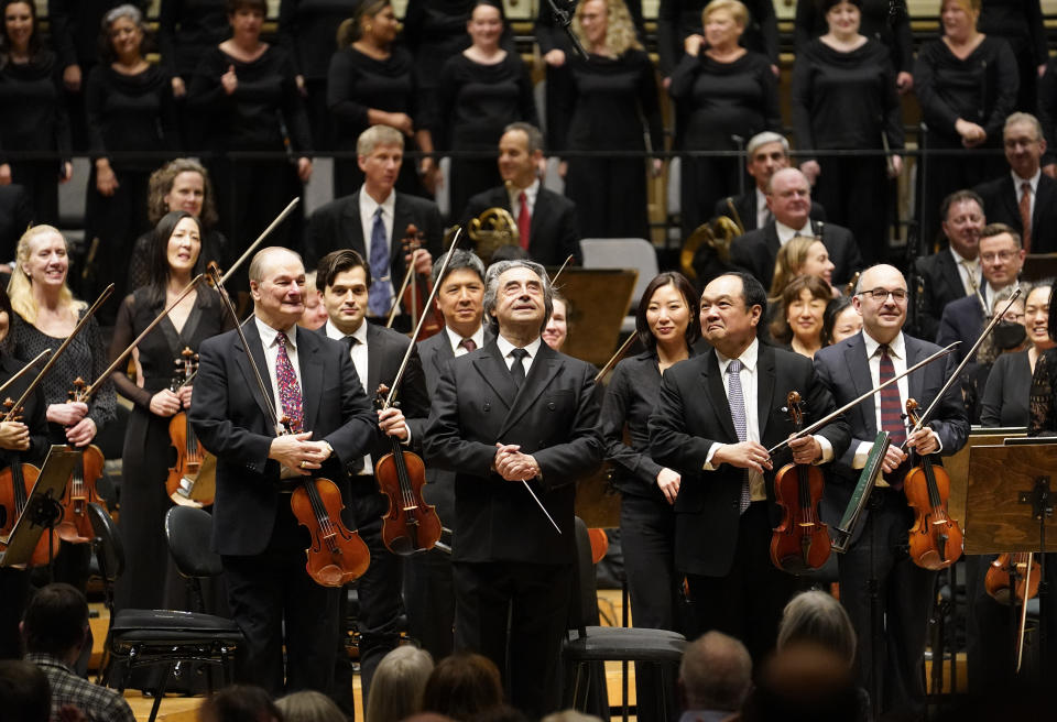 Riccardo Muti, musical director of the Chicago Symphony Orchestra, center, is applauded after conducting the orchestra and chorus in Beethoven's "Missa Solemnis" in D Major, Op. 123, Sunday, June 25, 2023, in Chicago. Sunday marked the last performance by Muti, 81, in Orchestra Hall during his 13 year tenure. (AP Photo/Charles Rex Arbogast)