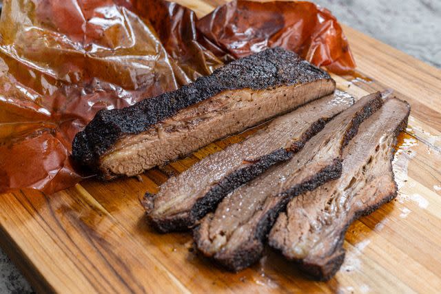 a group of pieces of meat on a wooden surface