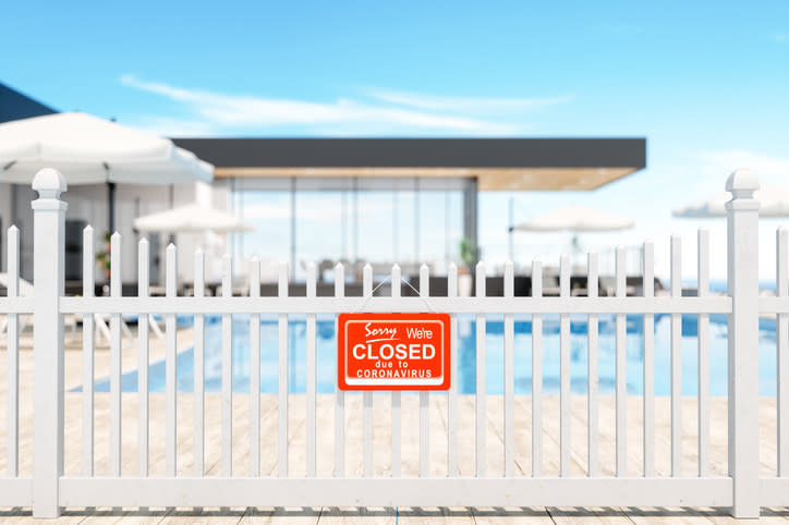 pool with a closed sign on the fence