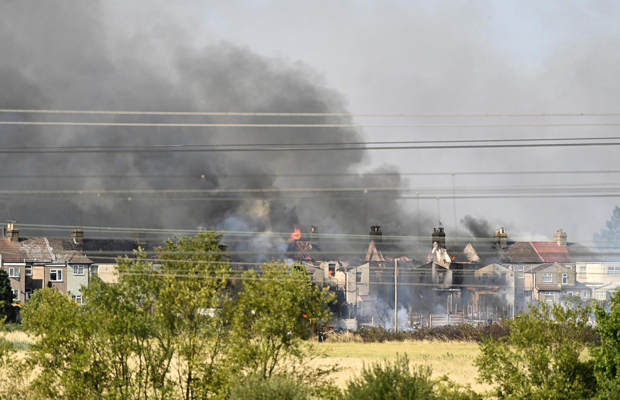 A fire burns in Rainham, a village in East London.