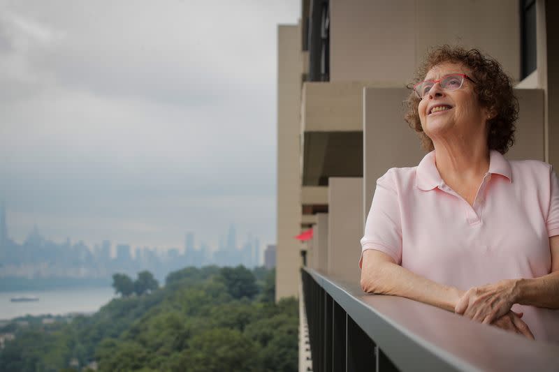 Laura Gross looks out from her balcony in Fort Lee, New Jersey