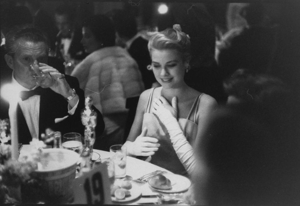 Actress Grace Kelly  with her Oscar for Best Actress (for 'The Country Girl'), at Romanoff's restaurant, following the 27th annual Academy Awards presentation at the RKO Pantages Theatre, Hollywood.  (Photo by George Silk/The LIFE Picture Collection via Getty Images)