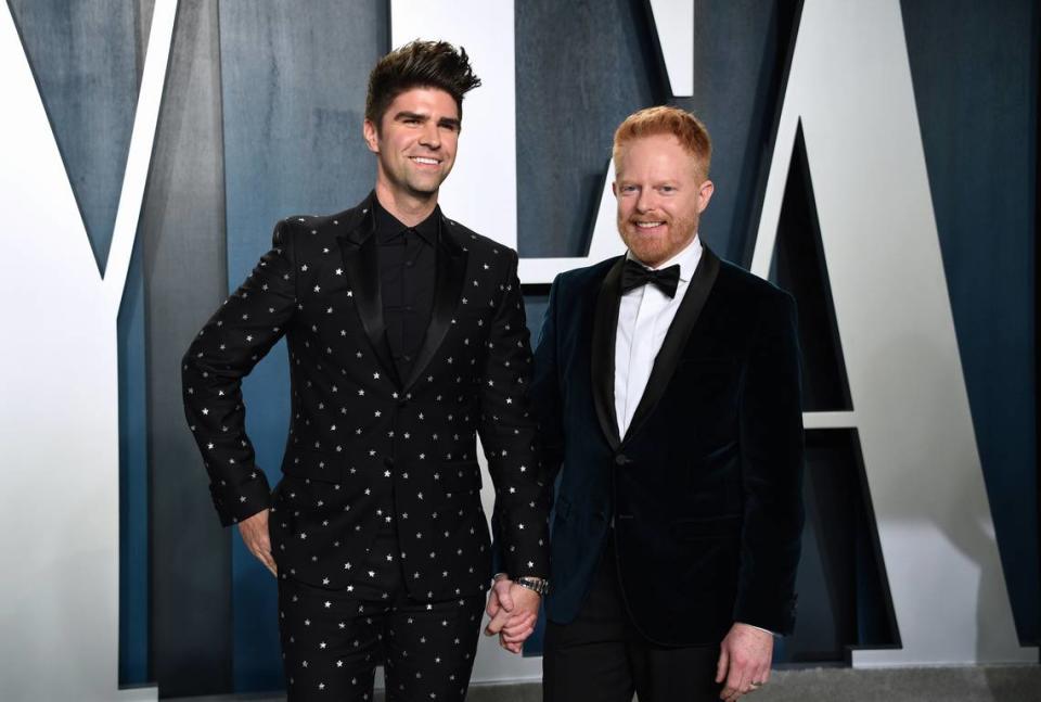 Justin Mikita, left, and Jesse Tyler Ferguson arrive at the Vanity Fair Oscar Party on Sunday, Feb. 9, 2020, in Beverly Hills, Calif. (Photo by Evan Agostini/Invision/AP)