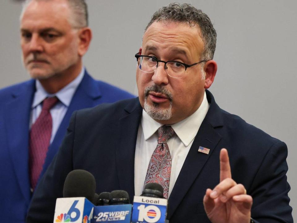 The U.S. Secretary of Education Miguel Cardona, takes question from the media while Broward Superintendent of Schools Dr. Peter B. Licata, left, stands at his side. Secretary Cardona participated in a round table with parents of victims of the mass shooting by the invitation of U.S. Congressman Jared Moskowitz regarding school safety and mental health after visiting Marjory Stoneman Douglas High School on Monday, January 22, 2024, in Parkland, Florida.