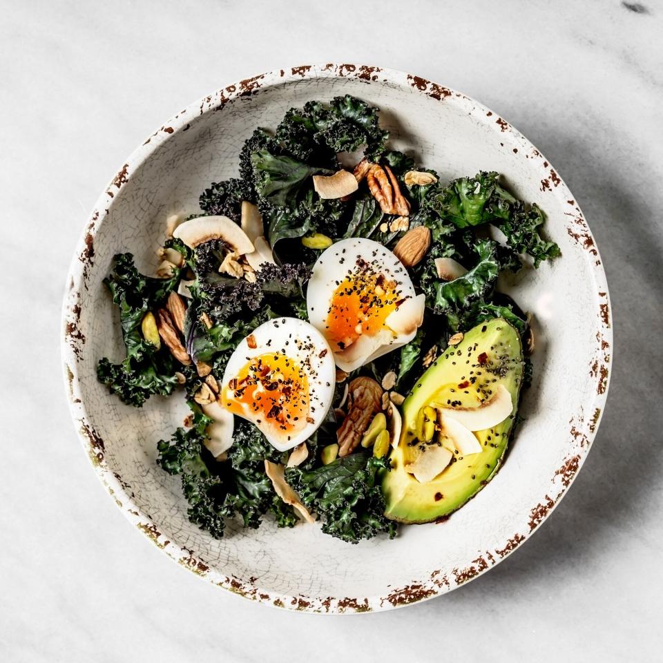 10 Ways to Make Your Home Greener: vegetarian salad dish with kale, avocado, and egg