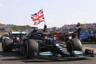 Mercedes driver Lewis Hamilton of Britain celebrates after winning the British Formula One Grand Prix, at the Silverstone circuit, in Silverstone, England, Sunday, July 18, 2021. (Lars Baron/Pool photo via AP)