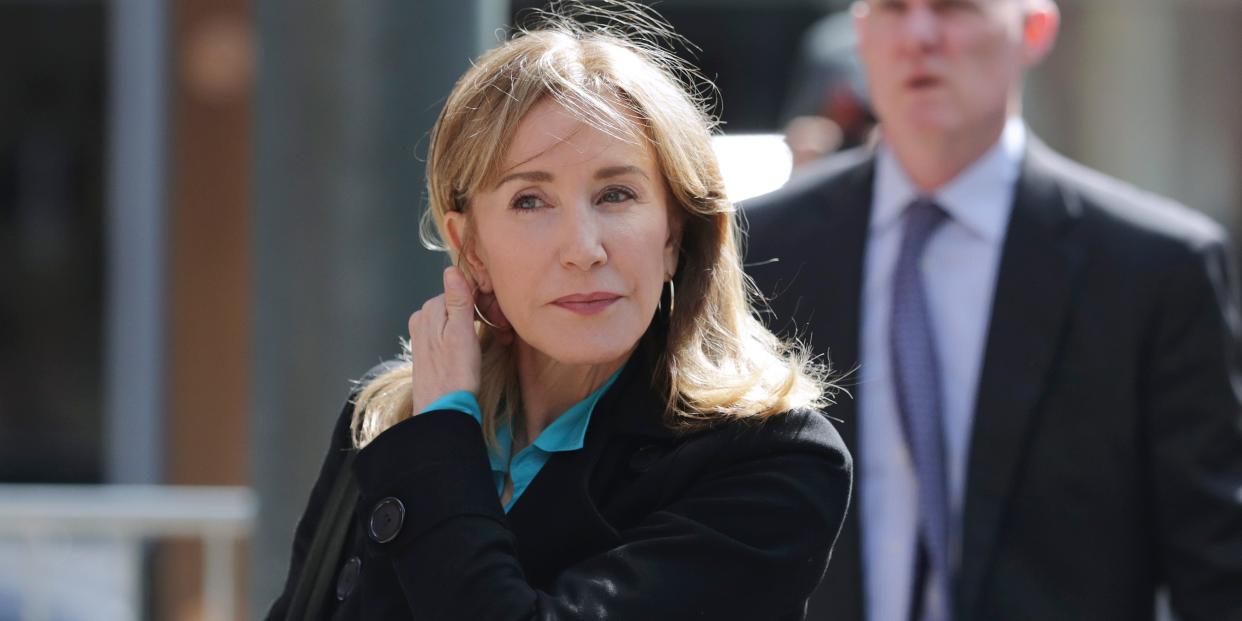 Actress Felicity Huffman arrives at federal court in Boston on Wednesday, April 3, 2019, to face charges in a nationwide college admissions bribery scandal. (AP Photo/Charles Krupa)