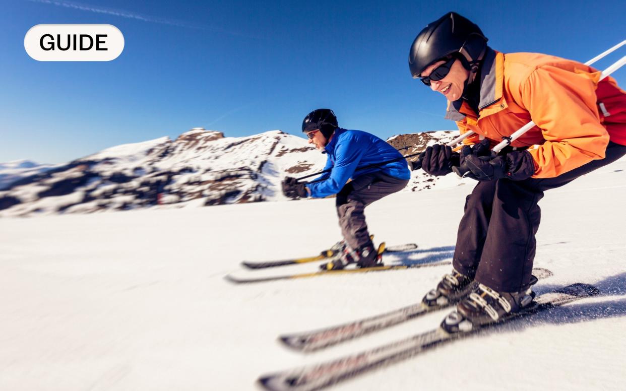 Two downhill skiers