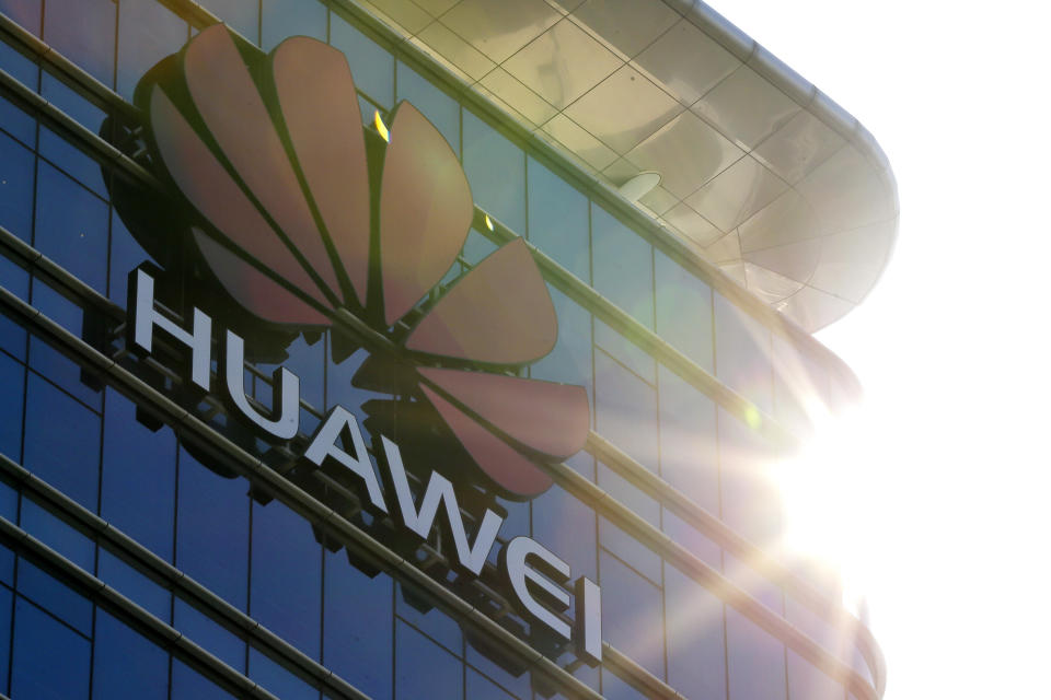 The logo of Huawei stands on its office building at the research and development centre in Dongguan in south China's Guangdong province, Tuesday, Dec. 18, 2018. While a top executive of Chinese tech giant Huawei faces possible U.S. charges over trade with Iran, the company's goal to be a leader in next-generation telecoms is colliding with security worries abroad. Australia and New Zealand have barred Huawei as a supplier for fifth-generation networks, joining the U.S. and Taiwan. Last week, Japan's cybersecurity agency said Huawei and other vendors deemed risky will be off-limits for government purchases. (AP Photo/Andy Wong)