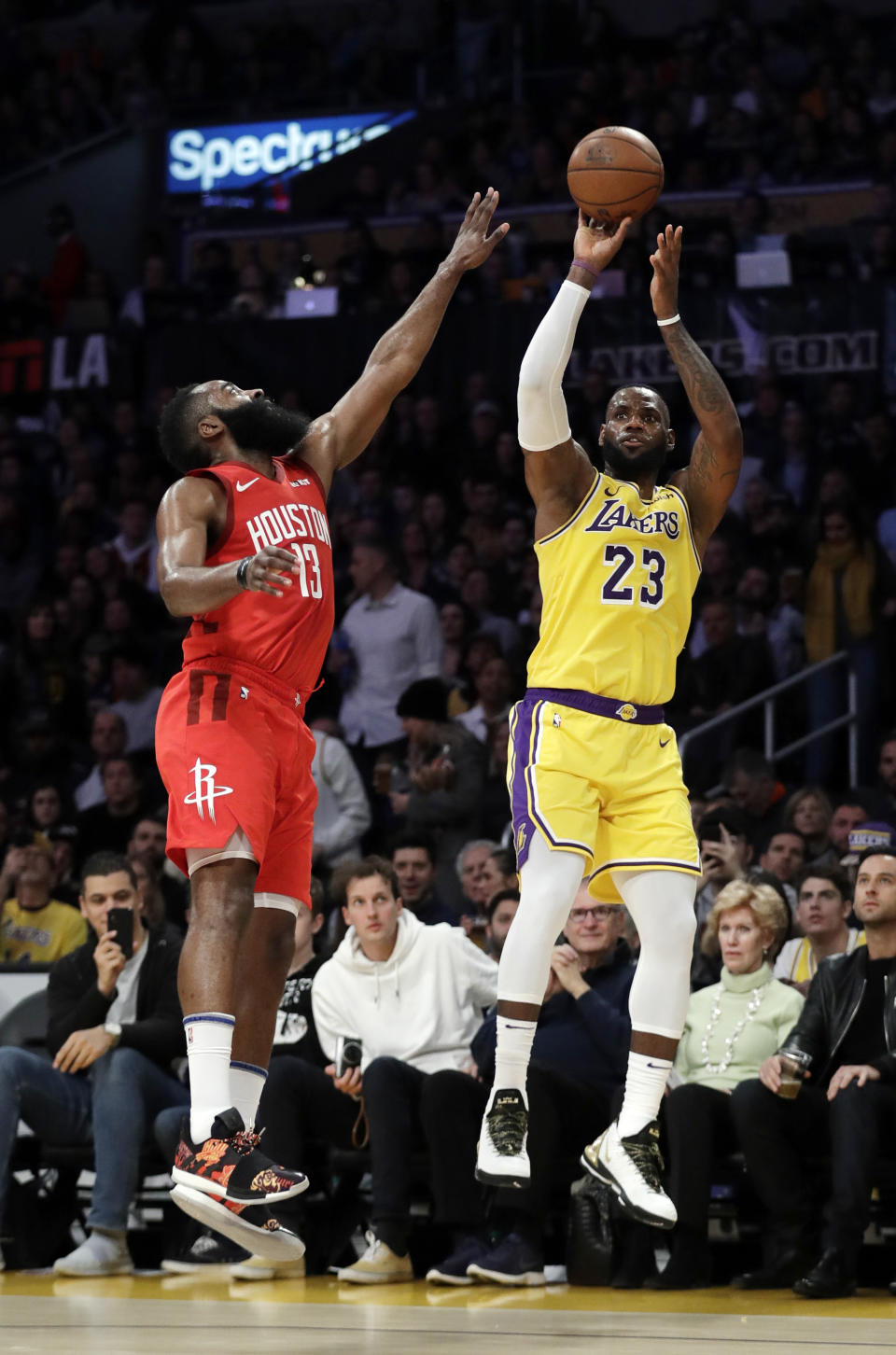 Los Angeles Lakers' LeBron James (23) shoots over Houston Rockets' James Harden during the first half of an NBA basketball game Thursday, Feb. 21, 2019, in Los Angeles. (AP Photo/Marcio Jose Sanchez)