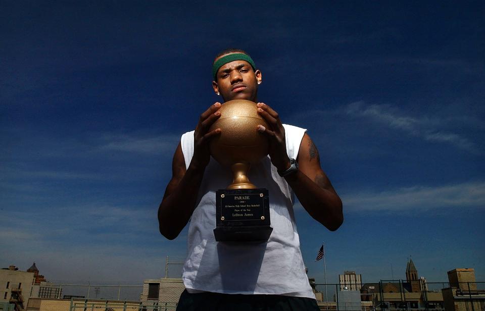 LeBron James of  St. Vincent-St. Mary with the Parade All-American Player of the Year award in March 2002.