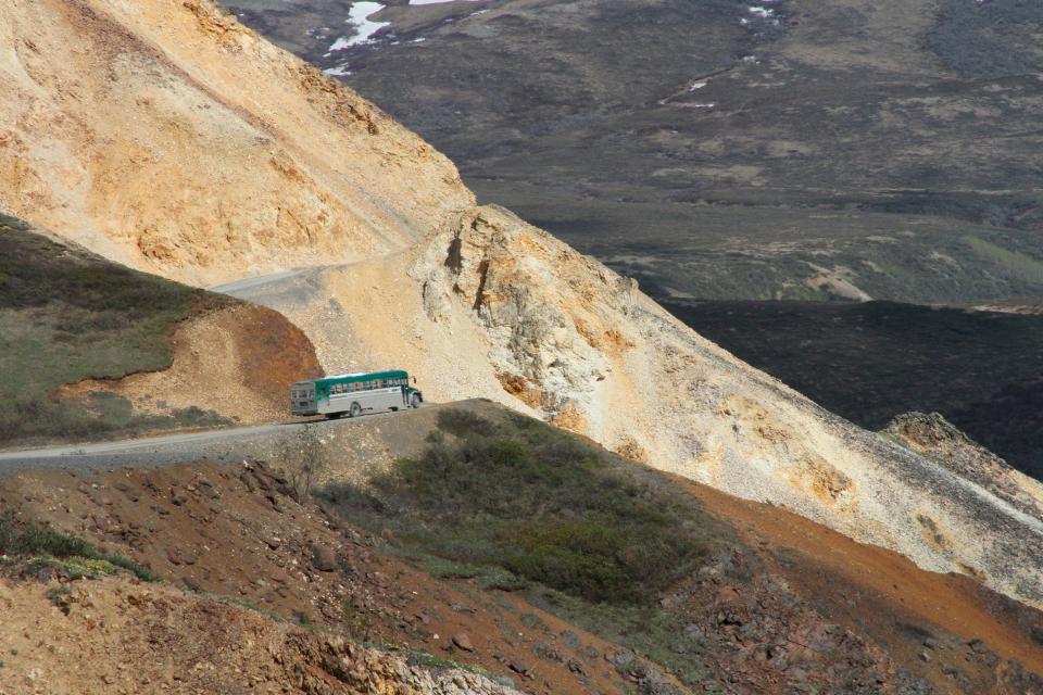 A tourist bus near Polychome Pass on the only road inside Denali National Park and Preserve, Alaska.