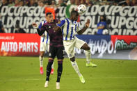 Honduras defenseman Maynor Figueroa (30 and Mexico forward Rogelio Funes Mori vie for the ball during the second half of a CONCACAF Gold Cup soccer match Saturday, July 24, 2021, in Glendale, Ariz. (AP Photo/Rick Scuteri)