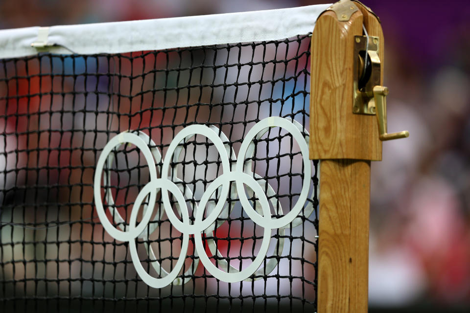 LONDON, ENGLAND - JULY 29: A detail view of a tennis net displaying the Olympic rings on Day 2 of the London 2012 Olympic Games at the All England Lawn Tennis and Croquet Club in Wimbledon on July 29, 2012 in London, England. (Photo by Clive Brunskill/Getty Images)