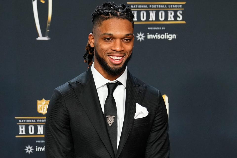 FILE - Buffalo Bills Damar Hamlin arrives for the NFL Honors award show ahead of the Super Bowl 57 football game, Thursday, Feb.  9, 2023, in Phoenix.  Hamlin has been cleared to resume playing and is attending the team's voluntary workout program some four months after going into cardiac arrest and having to be resuscitated on the field during a game at Cincinnati, general manager Brandon Beane said Tuesday, April 18, 2023.