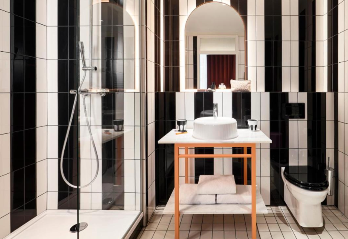 With a more-is-more style, bathrooms come in zebra-stripe tiles (Booking.com)