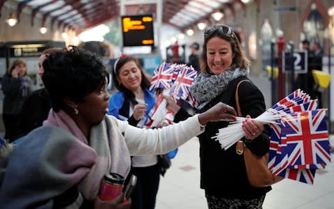 Wedding guests arrive by train at Windsor - Credit: BENOIT TESSIER /Reuters