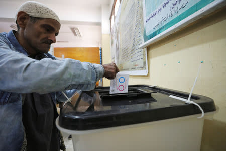 A man casts his vote during the referendum on draft constitutional amendments, at a polling station in Cairo, Egypt April 20, 2019. REUTERS/Mohamed Abd El Ghany
