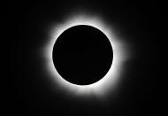 PALM COVE, AUSTRALIA - NOVEMBER 14: Totality is seen during the solar eclipse at Palm Cove on November 14, 2012 in Palm Cove, Australia. Thousands of eclipse-watchers have gathered in part of North Queensland to enjoy the solar eclipse, the first in Australia in a decade. (Photo by Ian Hitchcock/Getty Images)