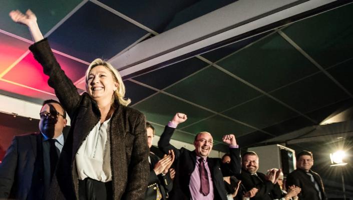 Marine Le Pen (L), president of France's far-right National Front party, reacts during a rally on February 7, 2015, in La Roche-sur-Foron (AFP Photo/Jean Philippe Ksiazek)
