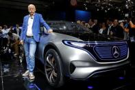 Dieter Zetsche, CEO of Daimler and Head of Mercedes-Benz, poses in front of a Mercedes EQ Electric car at the Mondial de l'Automobile, the Paris auto show, in Paris, France, September 29, 2016. REUTERS/Jacky Naegelen/File Photo