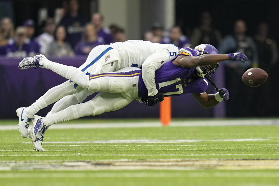 Indianapolis Colts cornerback Stephon Gilmore (5) breaks up a pass intended for Minnesota Vikings wide receiver K.J. Osborn (17) during the first half of an NFL football game, Saturday, Dec. 17, 2022, in Minneapolis. (AP Photo/Abbie Parr)