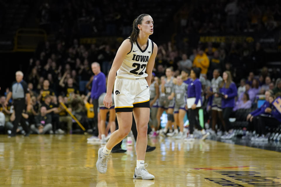 Iowa guard Caitlin Clark (22) celebrates after making a 3-point basket during the first half of an NCAA college basketball game against Kansas State, Thursday, Nov. 16, 2023, in Iowa City, Iowa. (AP Photo/Charlie Neibergall)