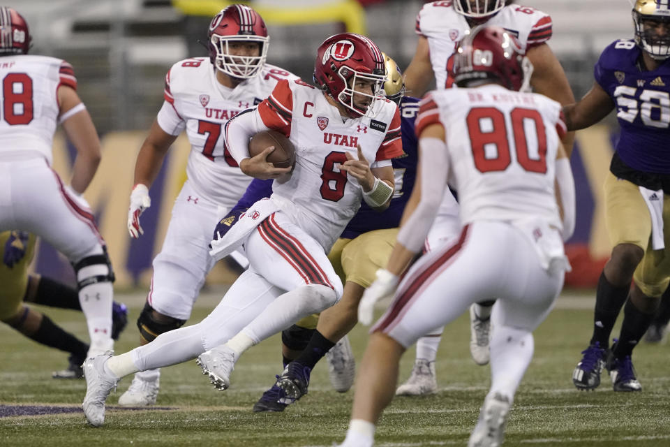 Utah quarterback Jake Bentley (8) keeps the ball against Washington during the first half of an NCAA college football game Saturday, Nov. 28, 2020, in Seattle. (AP Photo/Ted S. Warren)