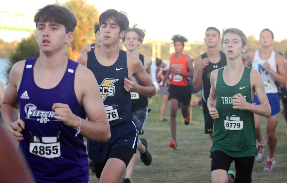 Runners race during the boys varsity event at  the Katie Caples Invitational cross country race on September 25, 2021. [Clayton Freeman/Florida Times-Union]