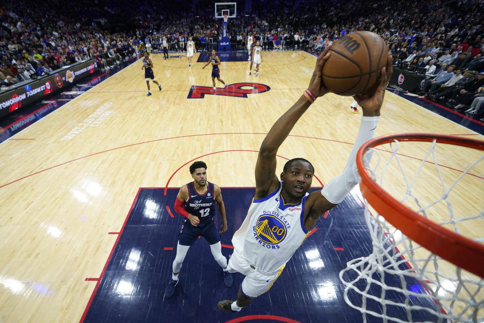 Golden State Warriors' Jonathan Kuminga goes up for a dunk during the first half of an NBA basketball game against the Philadelphia 76ers, Wednesday, Feb. 7, 2024, in Philadelphia. (AP Photo/Matt Slocum)