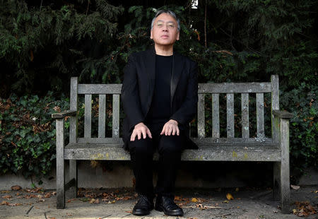 Author Kazuo Ishiguro poses for the media outside his home, following the announcement that he has won the Nobel Prize for Literature, in London, Britain October 5, 2017. REUTERS/Toby Melville