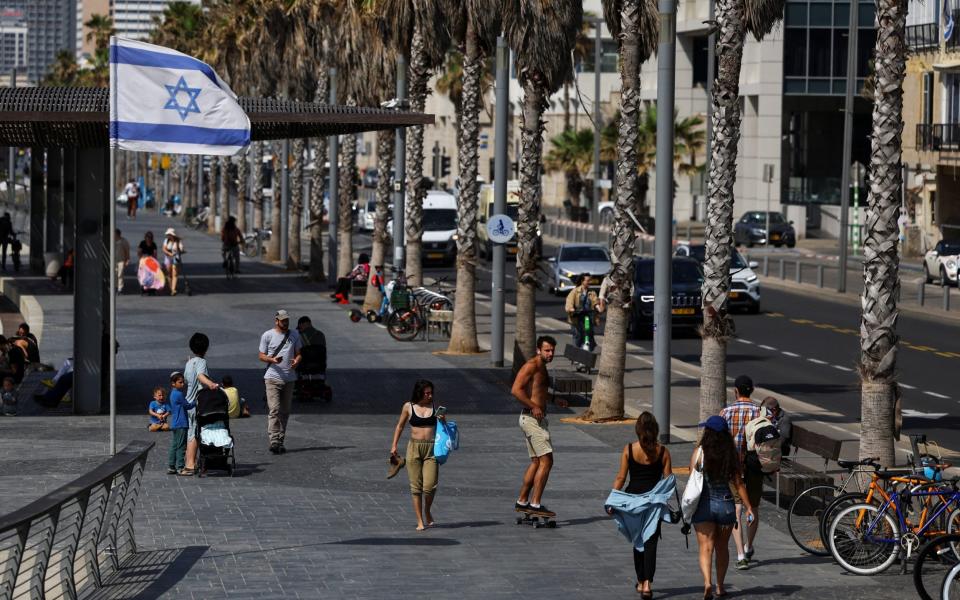 A man rides a skateboard in Tel Aviv, Israel