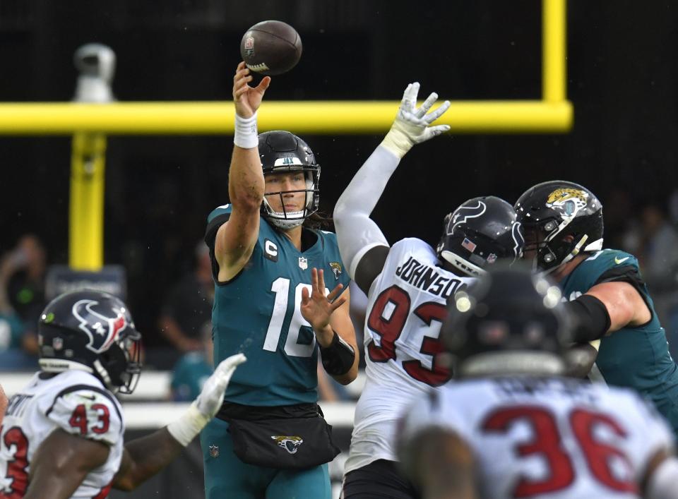 Jacksonville Jaguars quarterback Trevor Lawrence (16) gets off a pass against the Houston Texans at TIAA Bank Field in Jacksonville on Dec. 19, 2021.