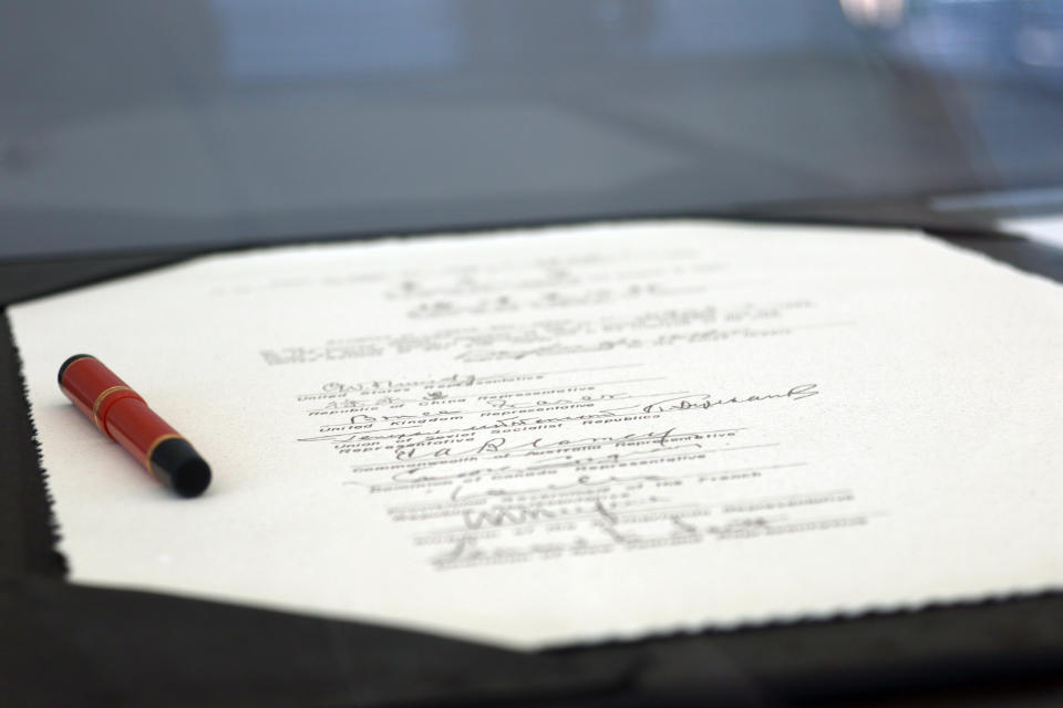 In this Aug. 15, 2020, photo, signed surrender documents from World War II are shown on the USS Missouri Memorial in Pearl Harbor, Hawaii. Some veterans and government officials will gather Wednesday, Sept. 2, 2020, in Hawaii to mark the 75th anniversary of the surrender. (AP Photo/Caleb Jones)