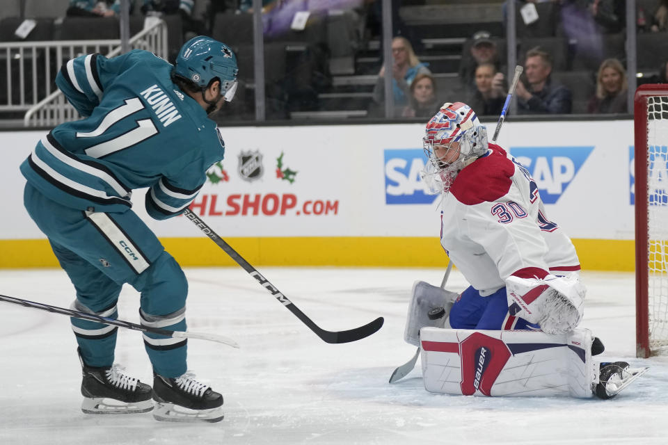 Montreal Canadiens goaltender Cayden Primeau (30) defends against a shot attempt by San Jose Sharks center Luke Kunin (11) during the first period of an NHL hockey game in San Jose, Calif., Friday, Nov. 24, 2023. (AP Photo/Jeff Chiu)