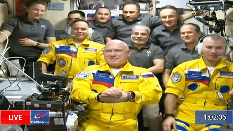 In this frame grab from video provided by Roscosmos, Russian cosmonauts Sergey Korsakov, Oleg Artemyev and Denis Matveyev are seen during a welcome ceremony after arriving at the International Space Station, the first new faces in space since the start of Russia's war in Ukraine. The crew emerged from the Soyuz capsule wearing yellow flight suits with blue stripes, the colors of the Ukrainian flag Russia Space Station, Outer Space - 18 Mar 2022